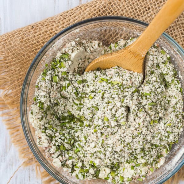 Ranch seasoning mix with a small wooden spoon.