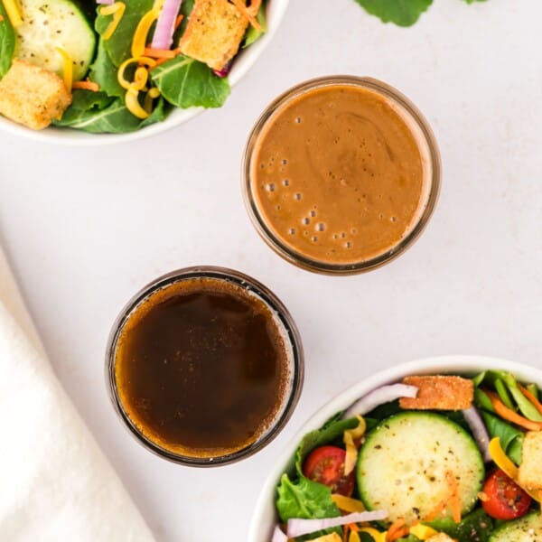 Overhead view of two different types of balsamic vinaigrette.