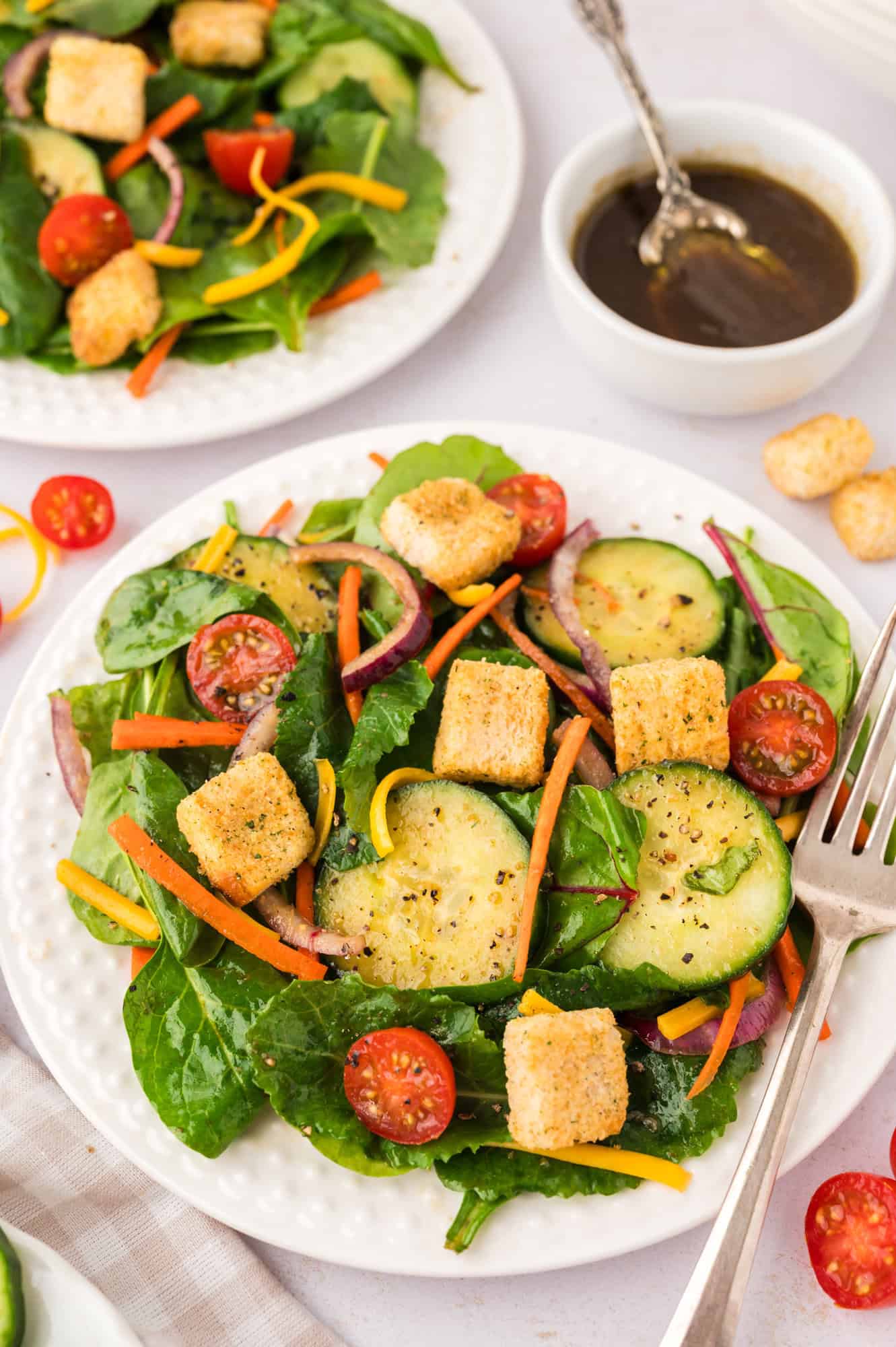 Plated house salad with balsamic vinaigrette.
