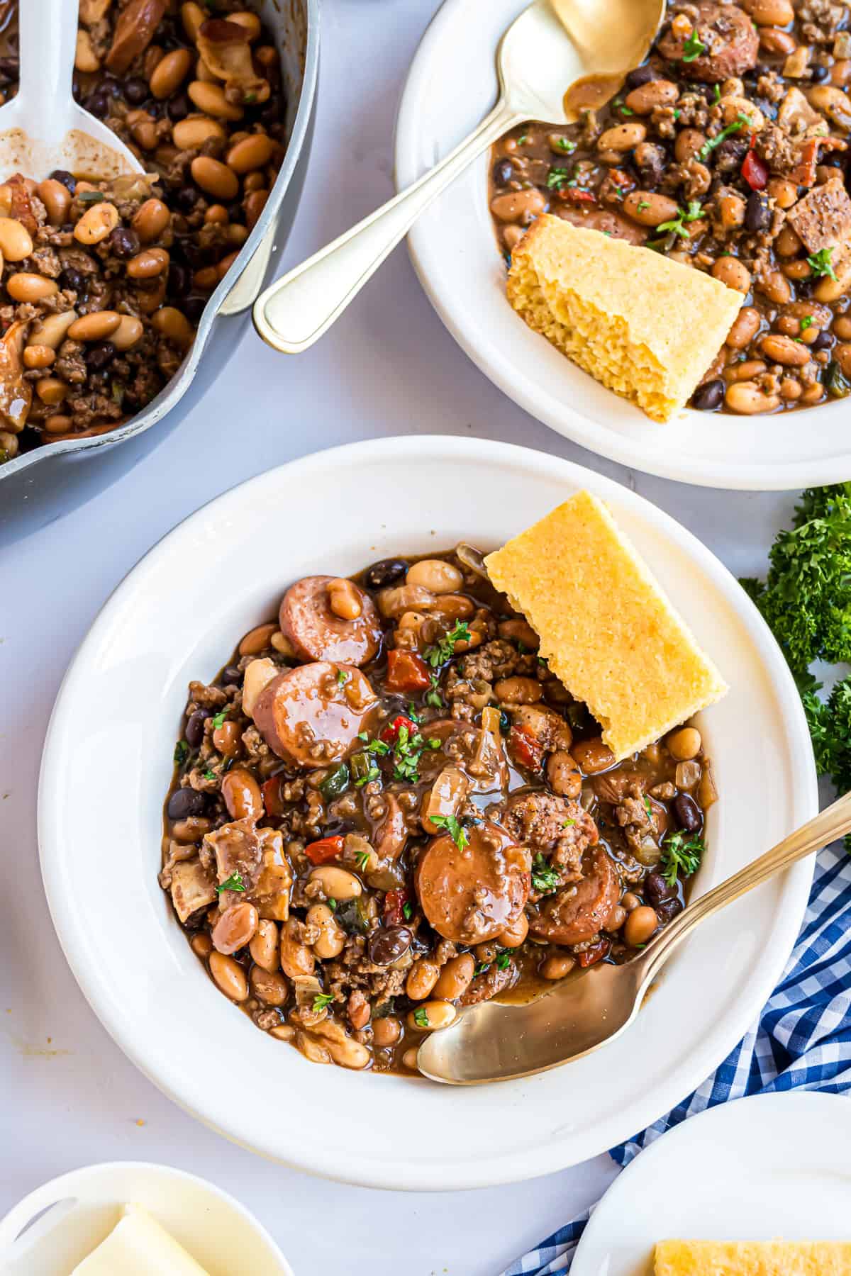 Cowboy beans in a bowl with a piece of cornbread.