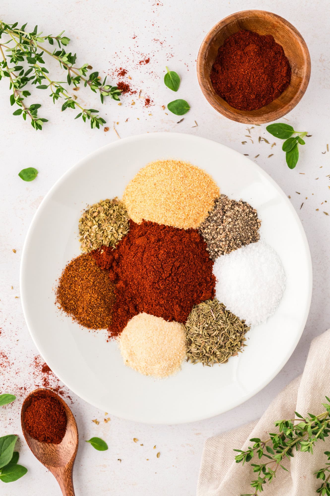 Spices for blackening seasoning in a bowl, not yet mixed together.