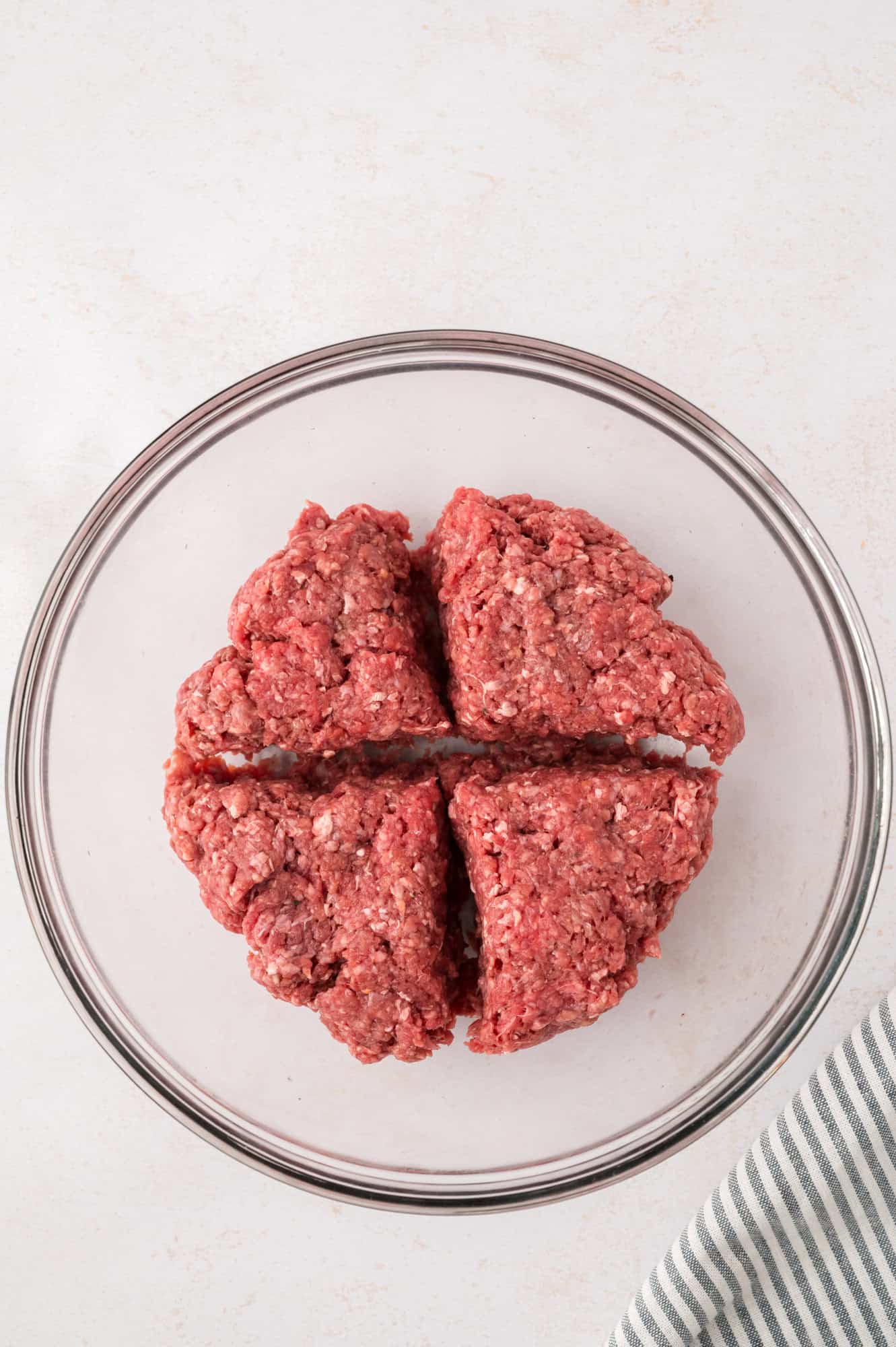Burger mixture divided into four parts.