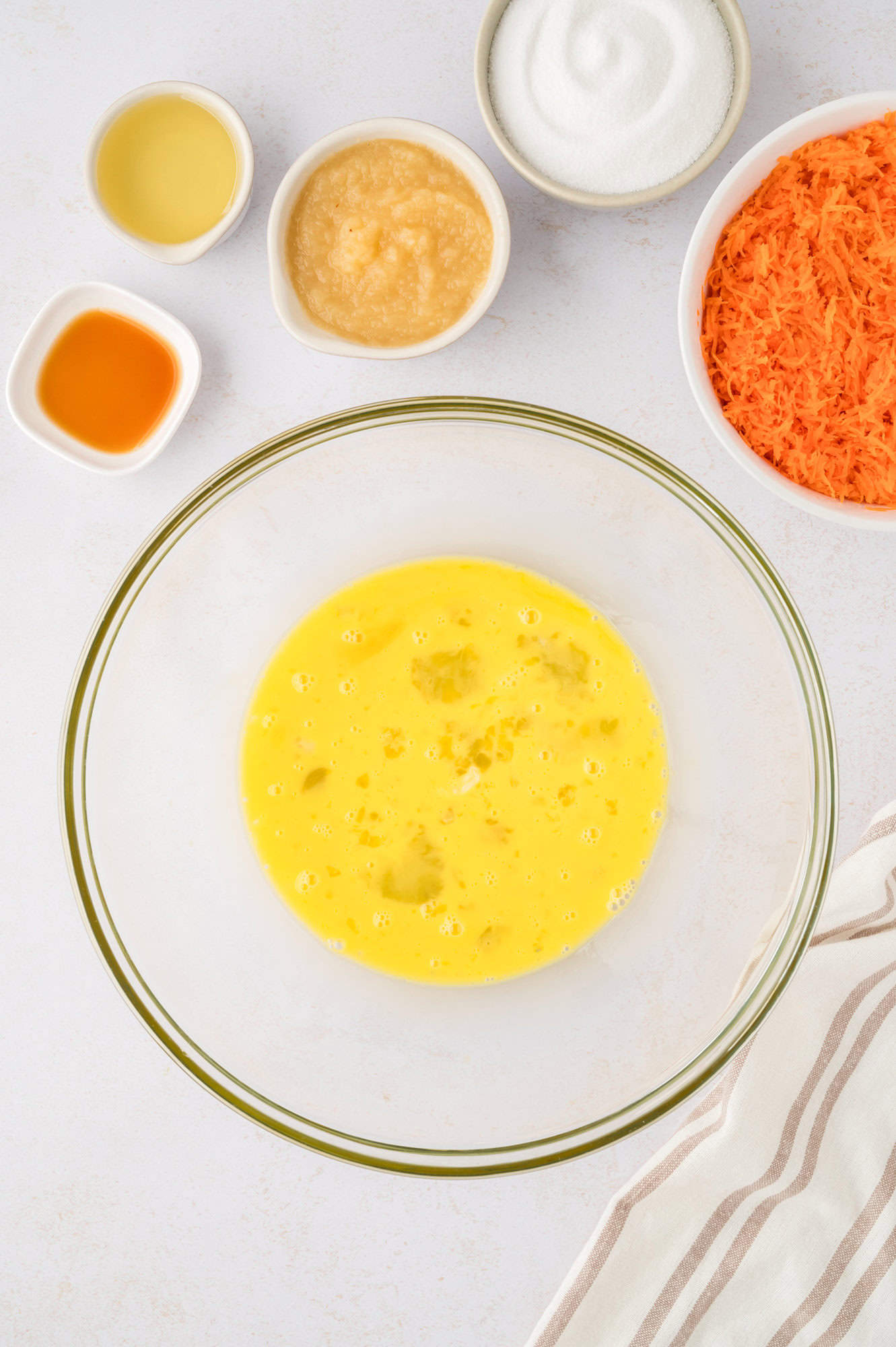 Beaten eggs in a large mixing bowl.
