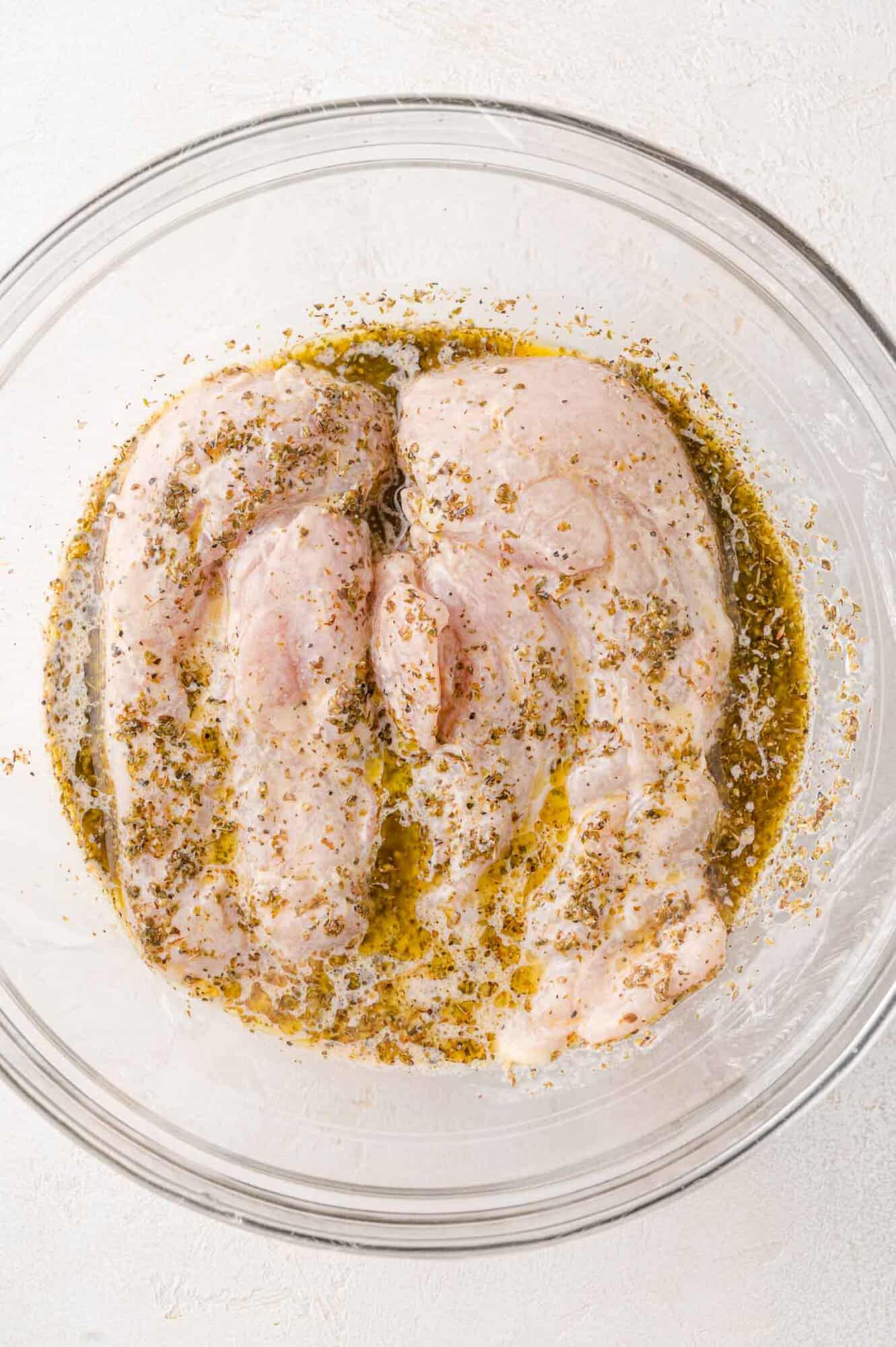 Chicken breasts in marinade.