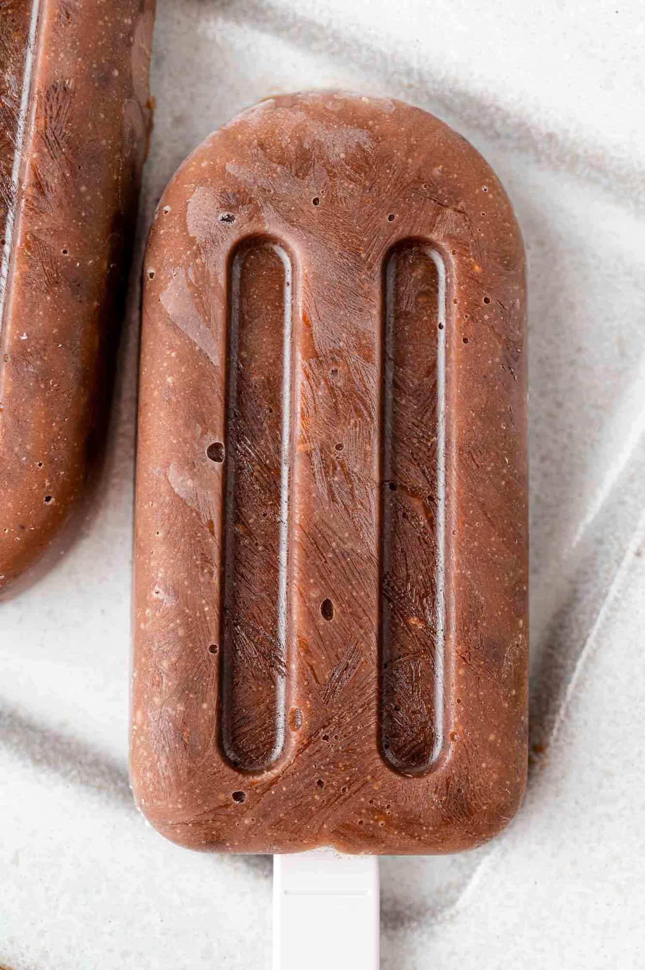 Chocolate pudding pop removed from mold.