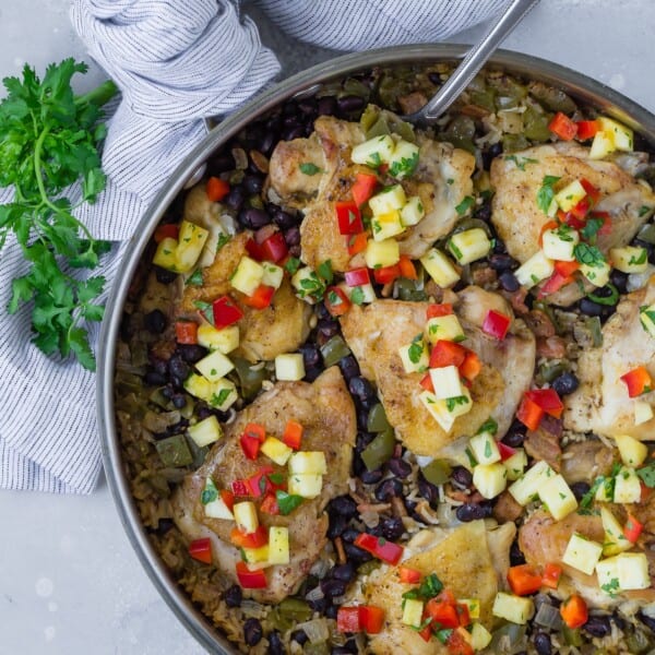 Overhead view of cuban chicken and rice, still in pan.