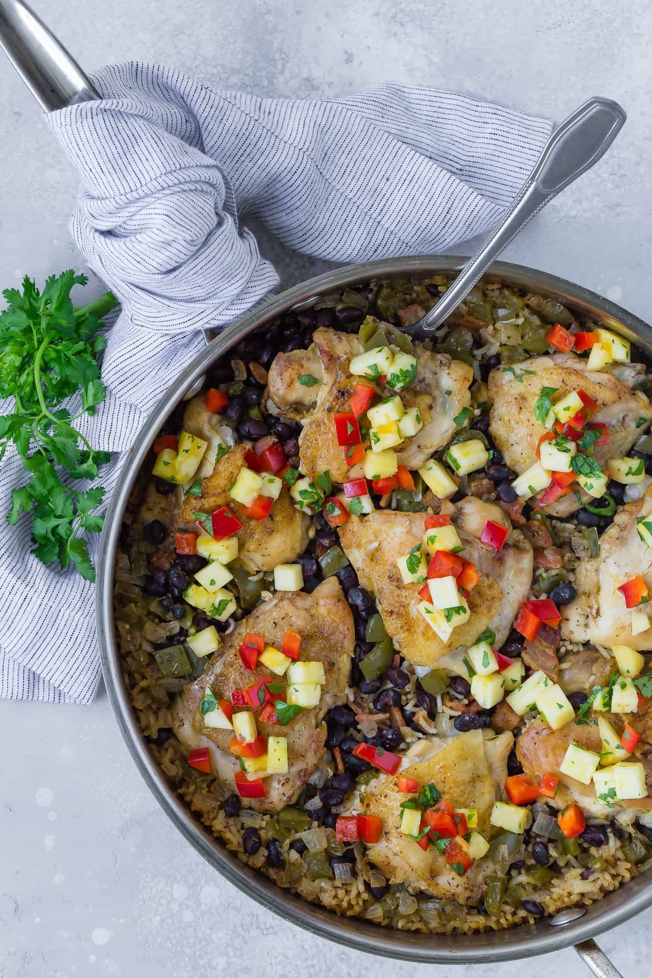 Overhead view of cuban chicken and rice, still in pan.