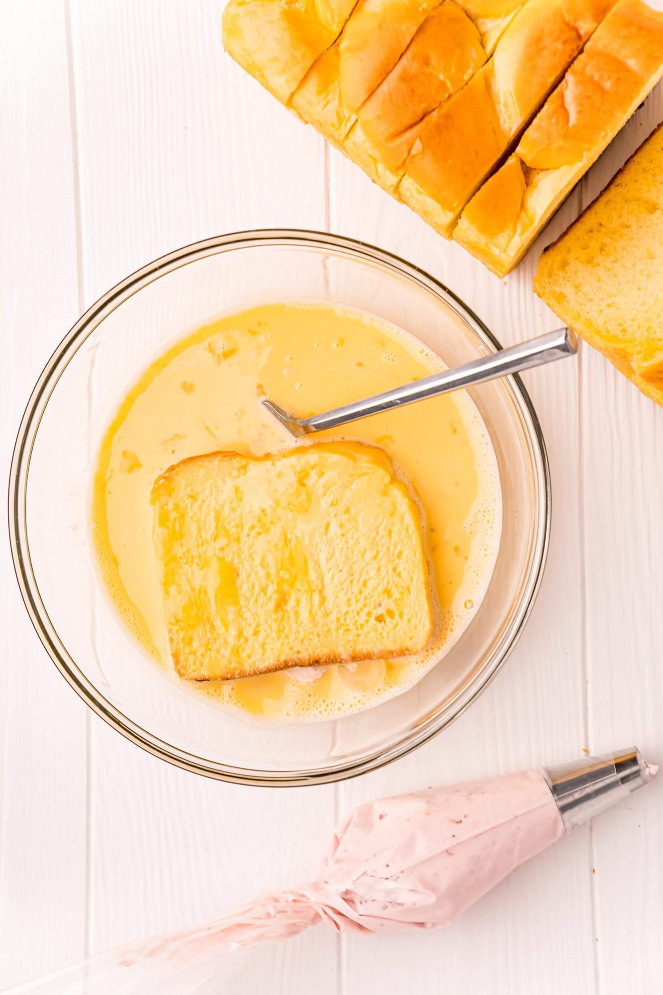 Bread flipped over and other side dipped in egg mixture.