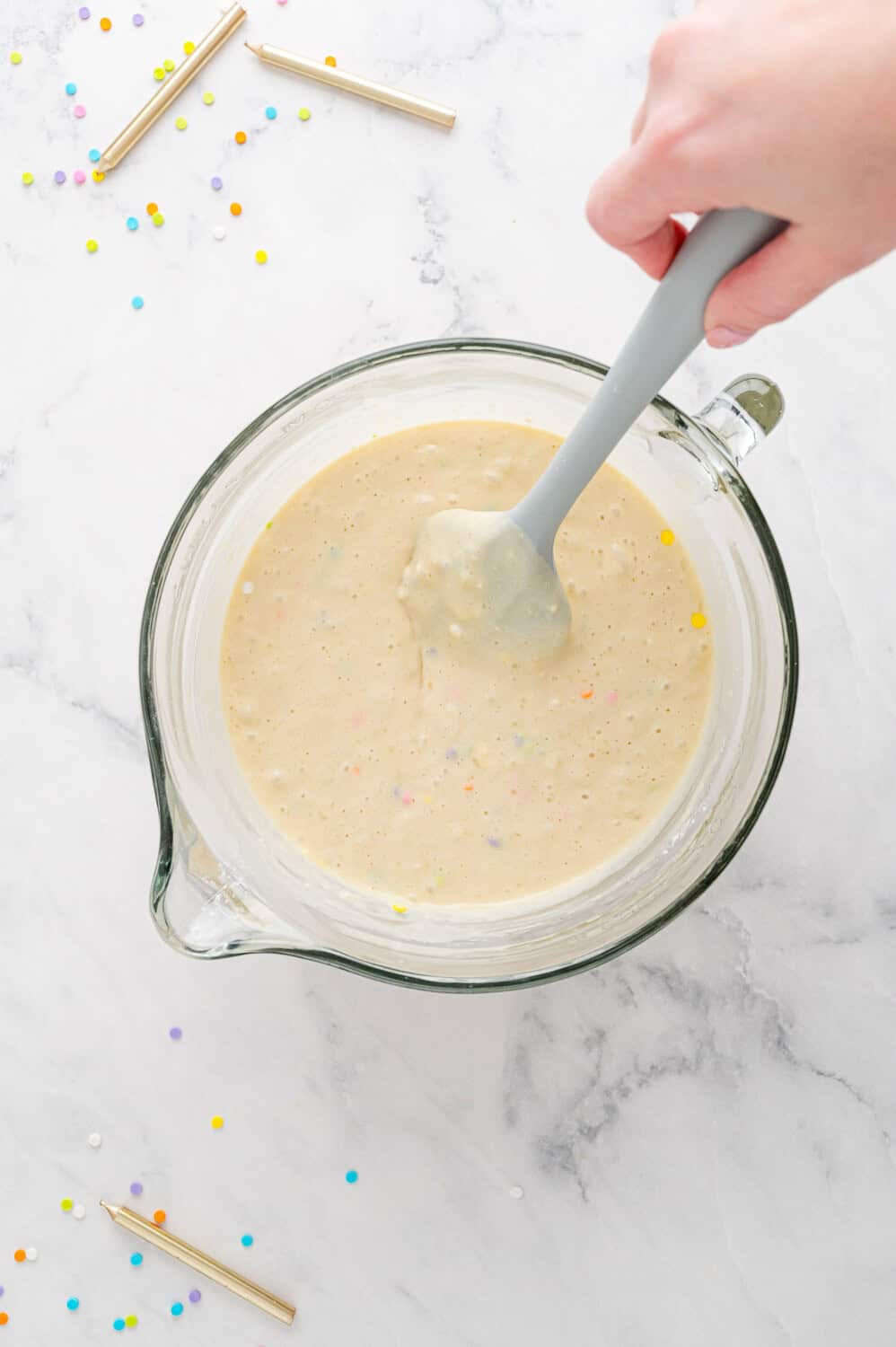 Sprinkles mixed into batter.