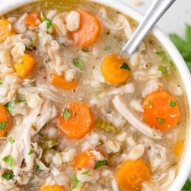 Overhead view of chicken barley soup.