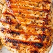 Greek Chicken Marinade Pinterest graphic with text and photos.