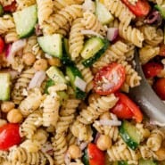 Greek Pasta Salad Pinterest graphic with text and photos.