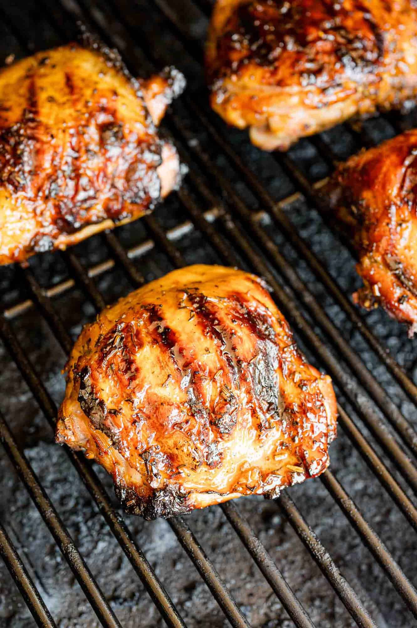Chicken thighs on a grill.