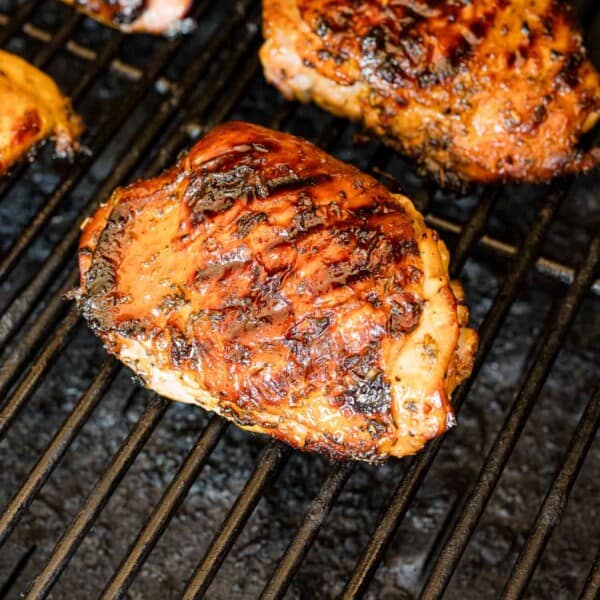 Chicken thighs on a grill.