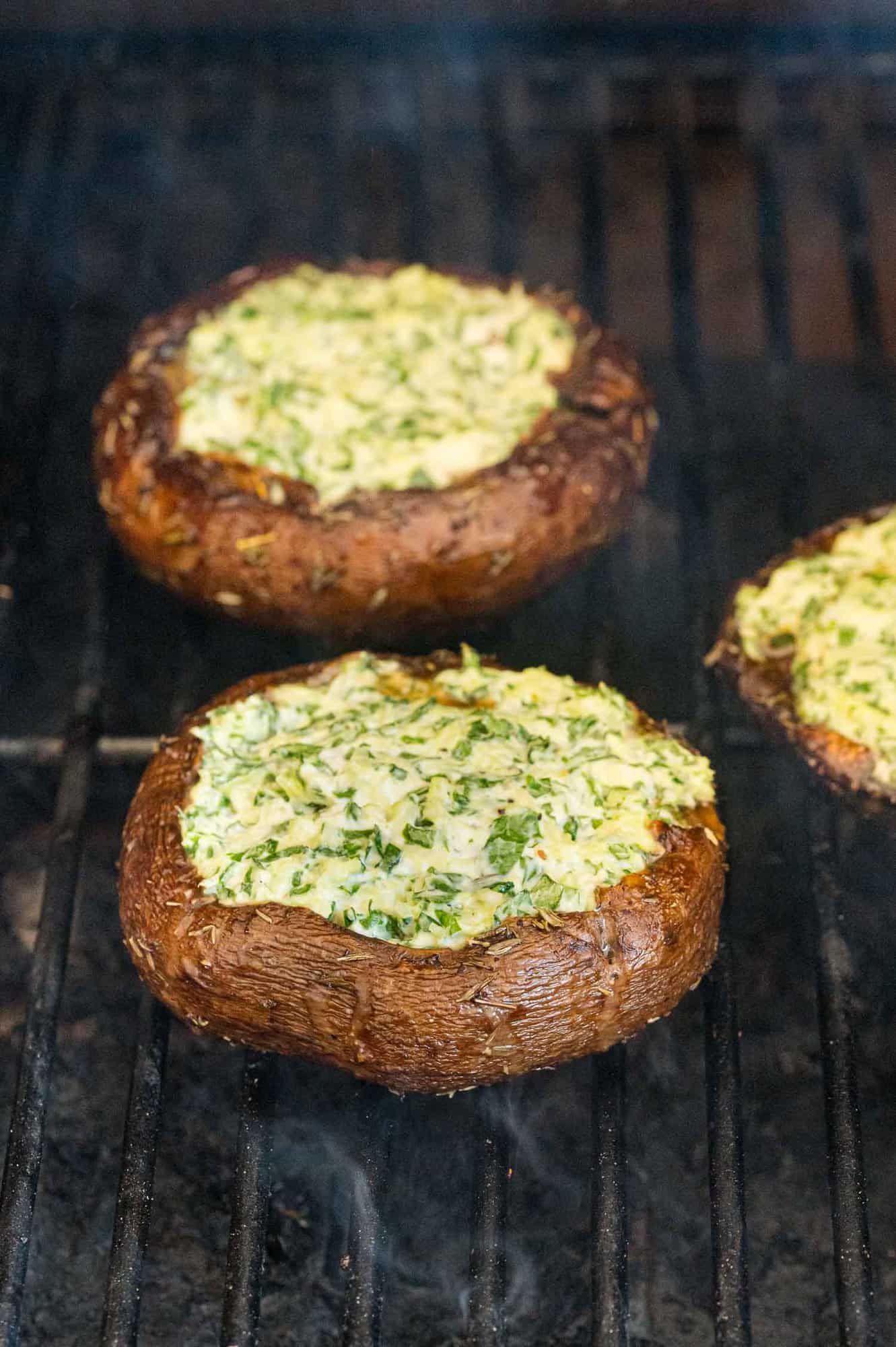 Stuffed mushrooms on grill.