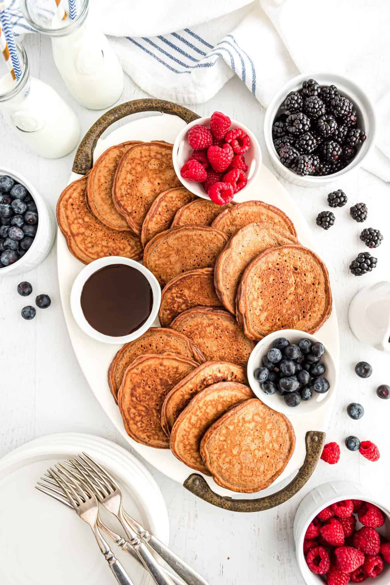 Chocolate protein pancakes spread on platter.