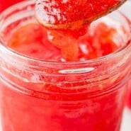 Strawberry Freezer Jam Pinterest graphic with text and photos.