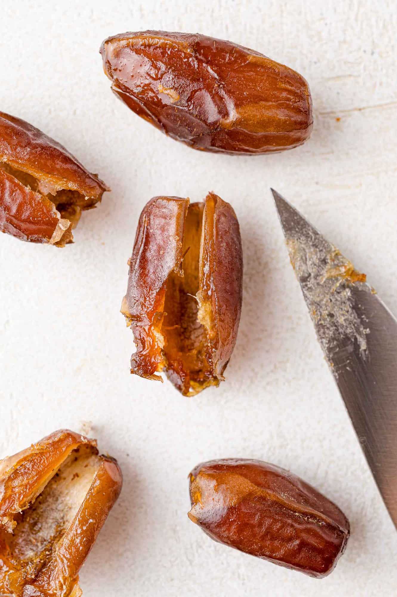 Dates, with slits cut in them.