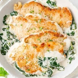Chicken Florentine in a skillet, with a spinach cream sauce.