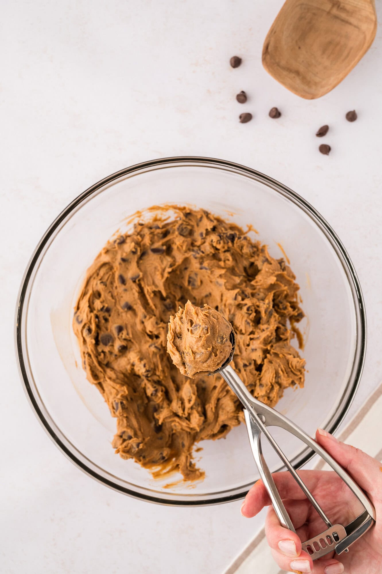 Cookie dough being scooped.