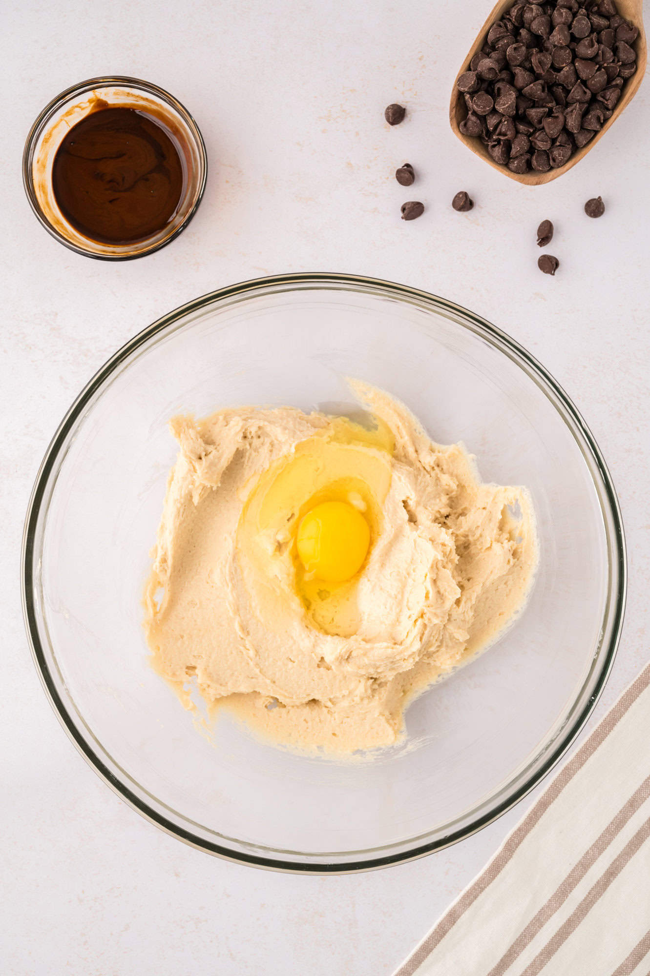 Egg added to butter and sugar mixture.