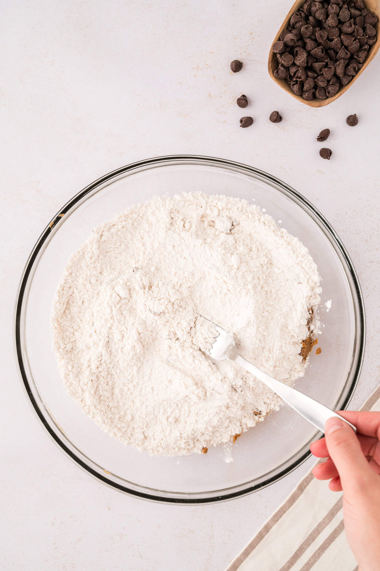 Dry ingredients being mixed up on top of wet ingredients.