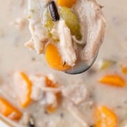Crockpot Chicken Wild Rice Soup Pinterest graphic with text and photos.