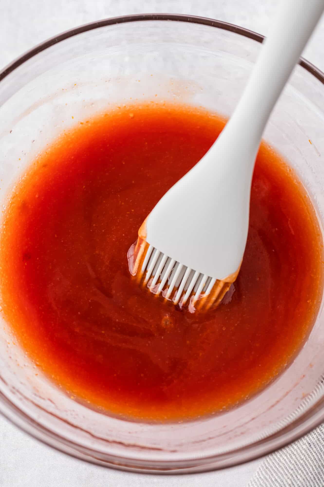 Glaze ingredients mixed together in a small glass bowl.