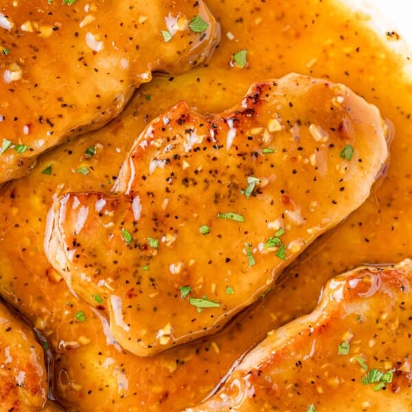 Honey garlic pork chops still in pan.