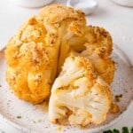 Whole roasted cauliflower, partially cut.