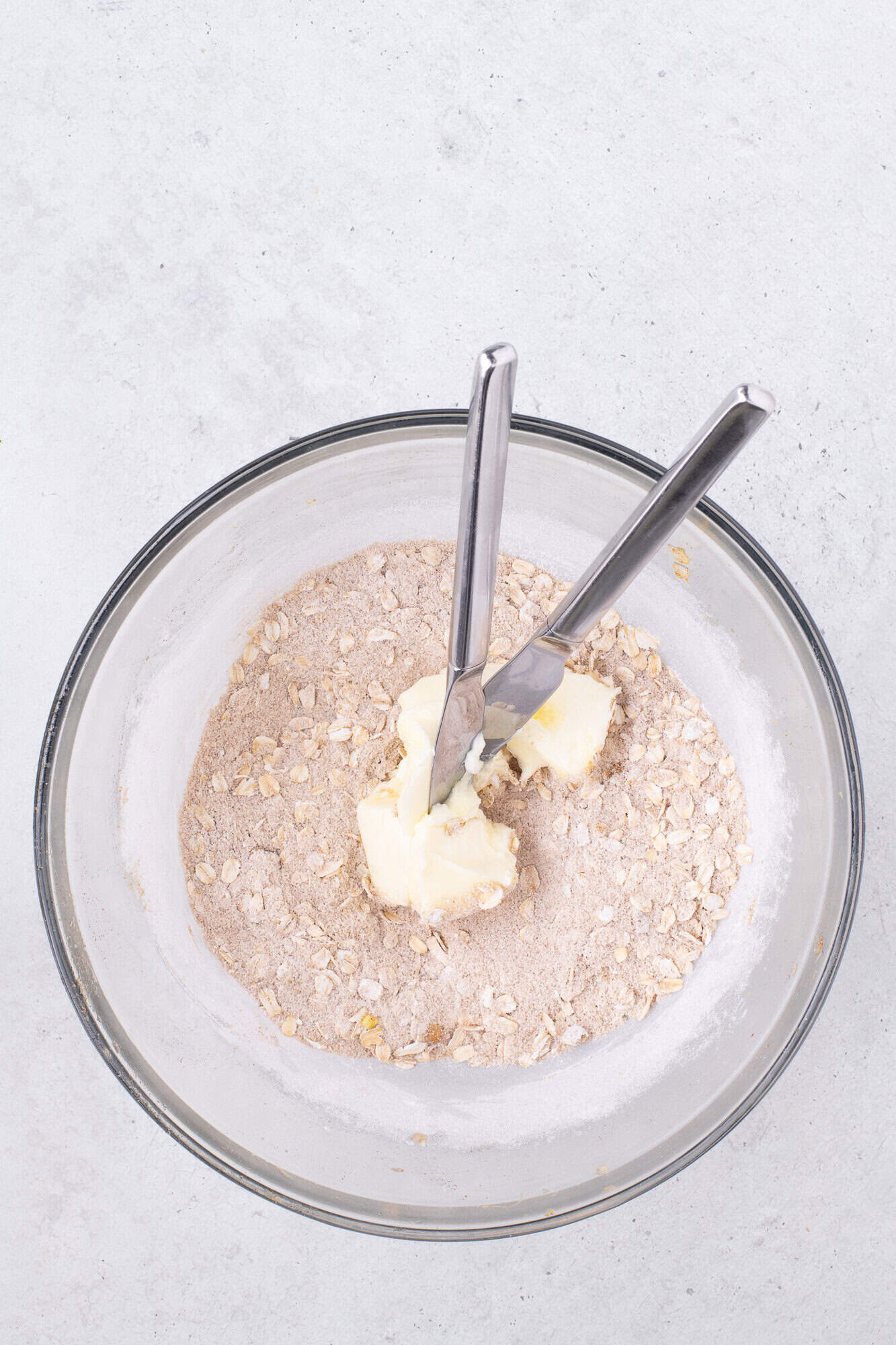 Butter added to other topping ingredients, not yet mixed in.