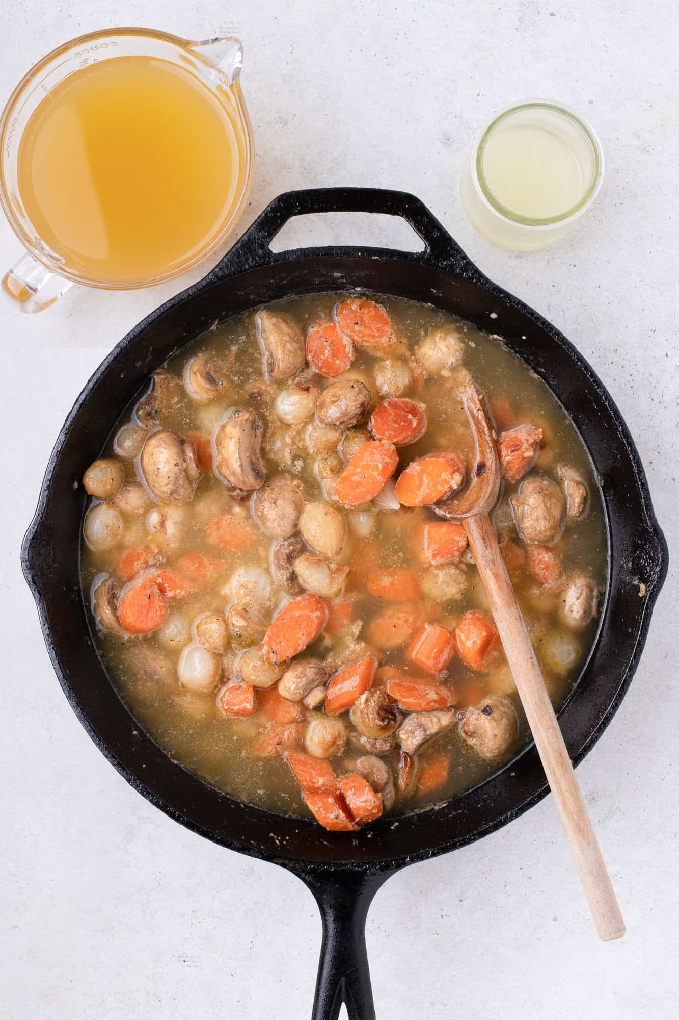 Chicken broth added to vegetables.