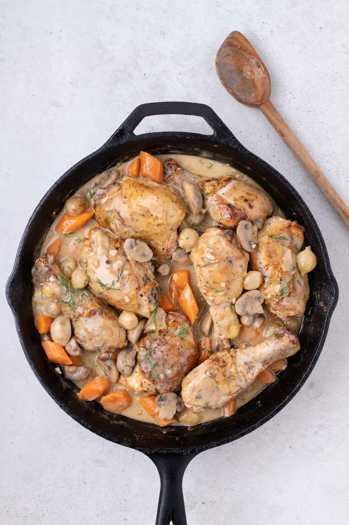 Chicken added back into pan, dish completed in black skillet.