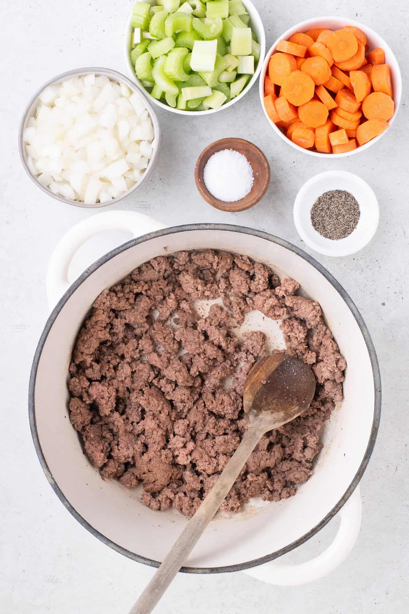 Ground beef sautéed in a large pot.