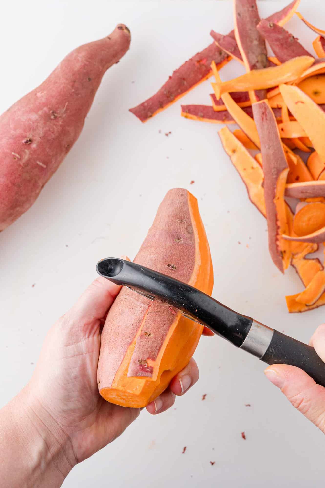 Sweet potato being peeled.