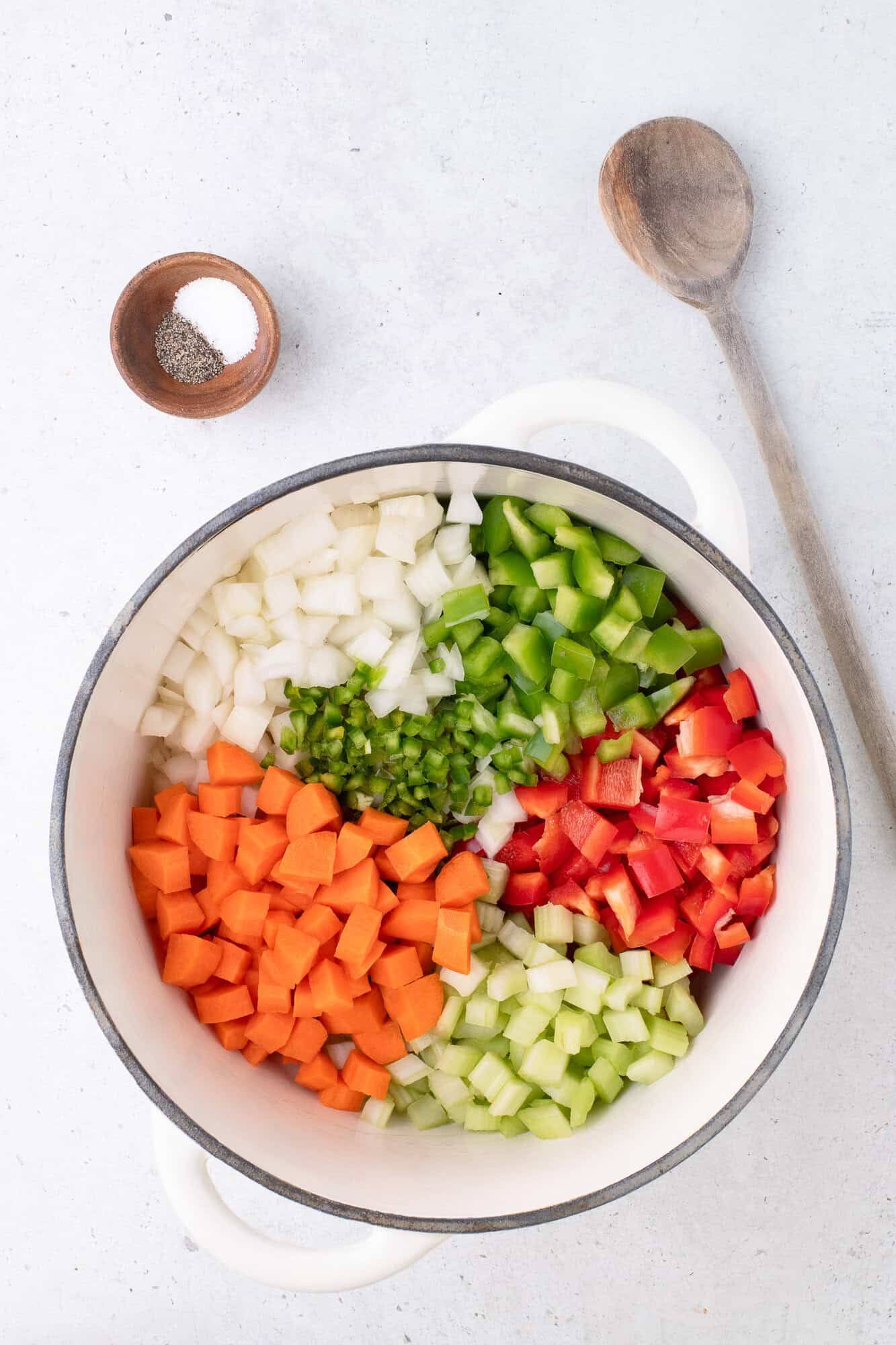 Vegetables in a large pot, before sautéing. 