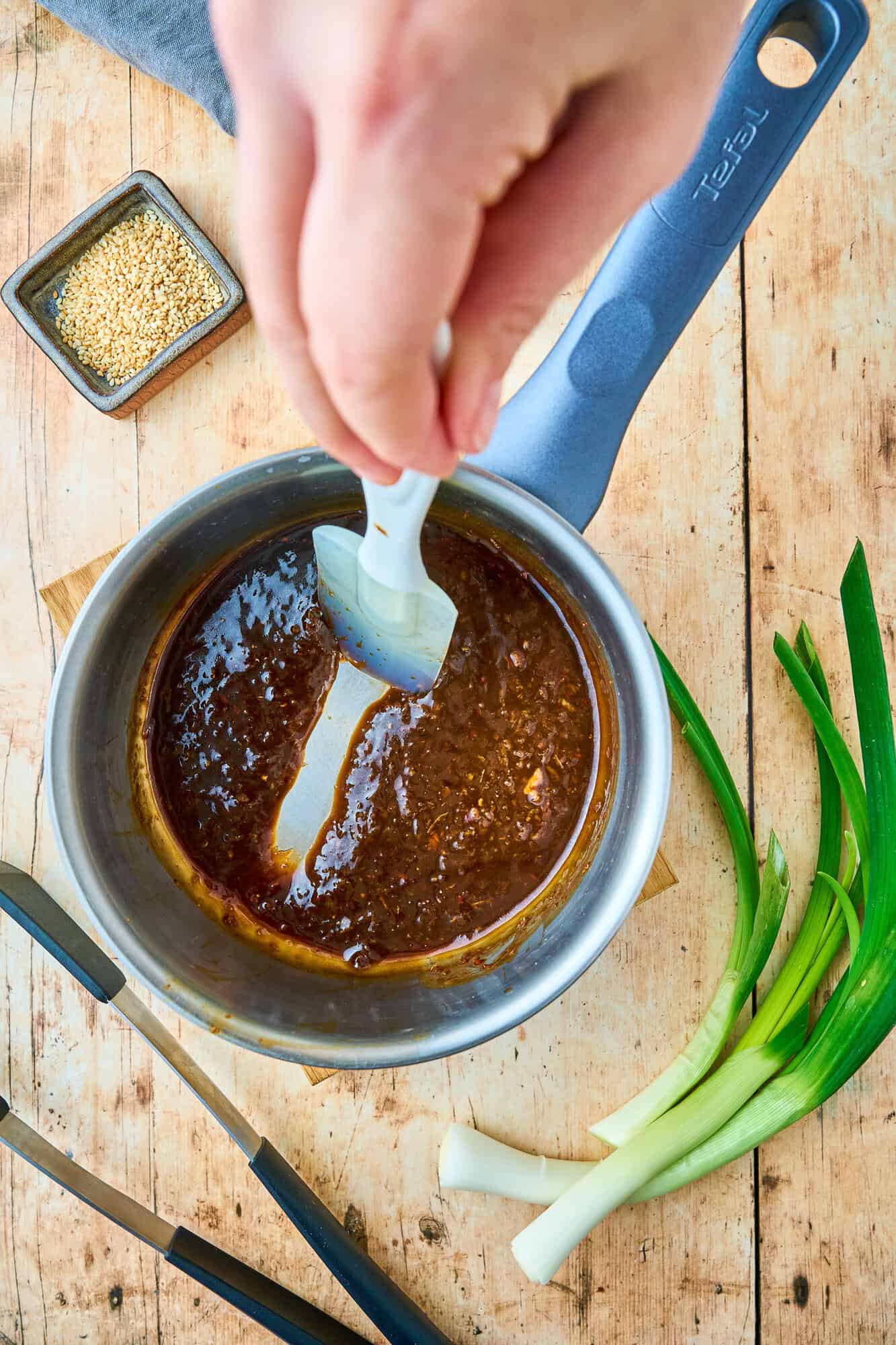 Marinade, after cooking down into a sauce, spatula running through it to show thickness.