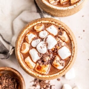 Overhead view of oat milk hot chocolate topped with marshmallows.