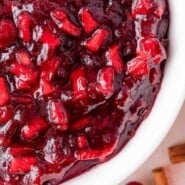 Cinnamon Apple Cranberry Sauce Pinterest graphic with text and photos.
