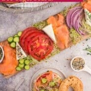 Bagel and Lox Board Pinterest graphic with text and photos.