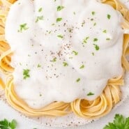 Cauliflower Alfredo Sauce Pinterest graphic with text and photos.