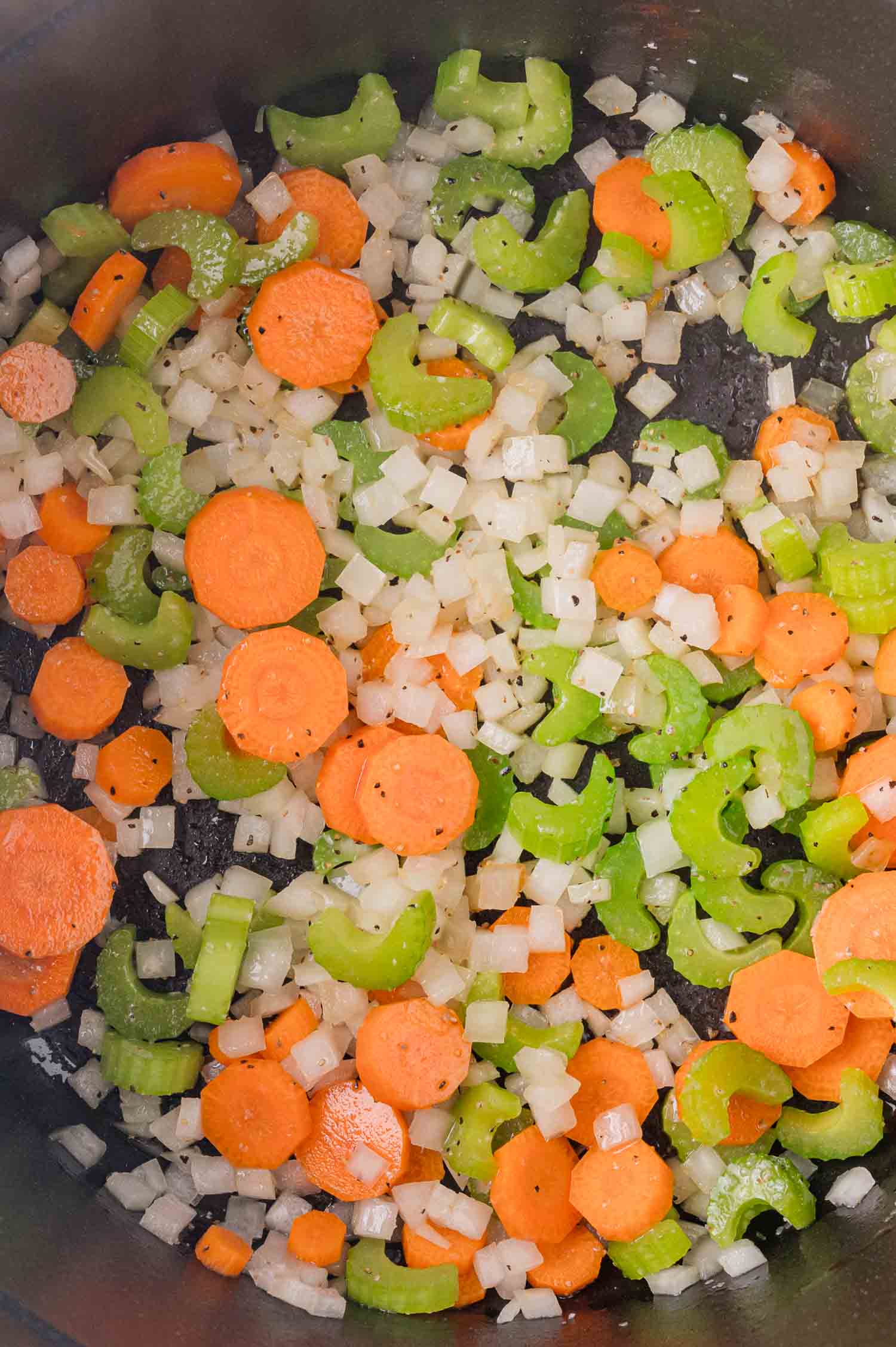 Black-Eyed Pea Soup 10 Chopped carrots, celery, and onions sautéing in a pan.