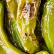 Blistered shishito peppers Pinterest graphic with text and photos.