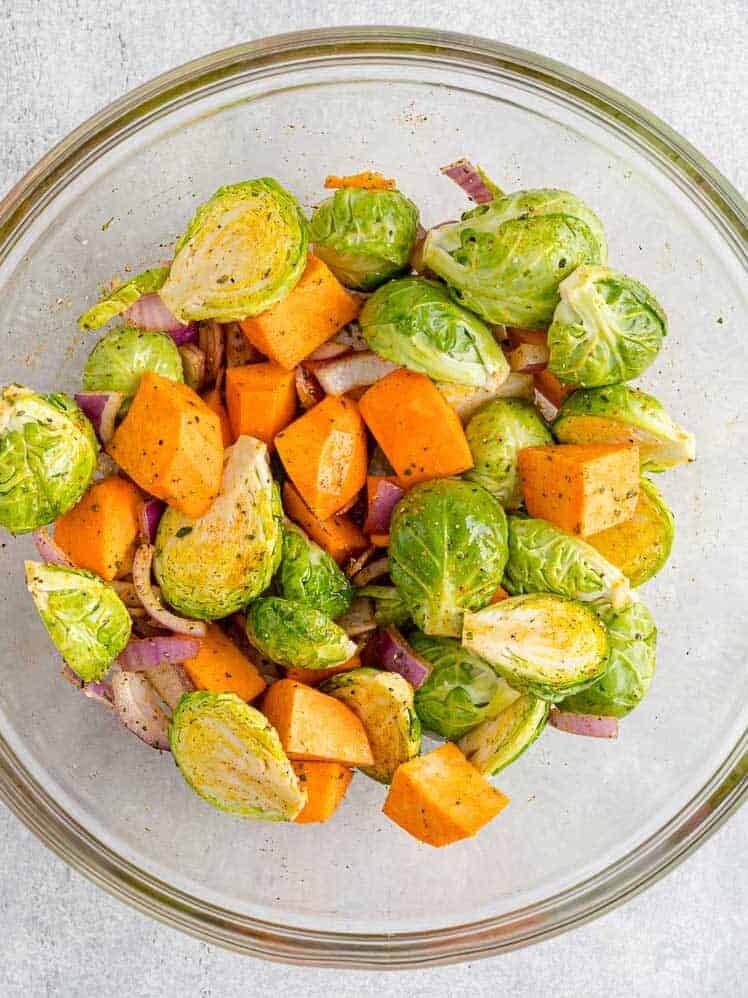 Vegetables mixed with oil and spices.