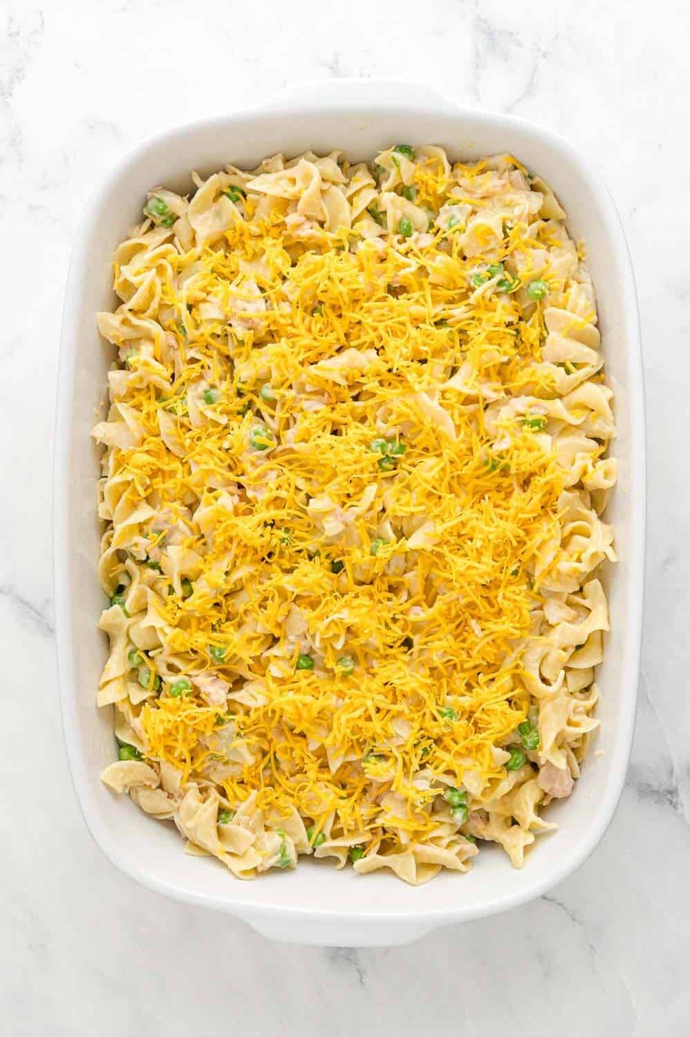 Unbaked casserole in a white dish.