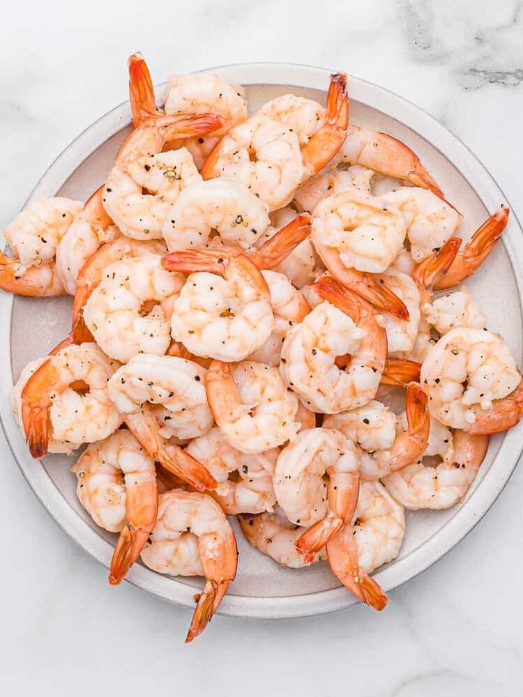 Cooked shrimp on a plate.