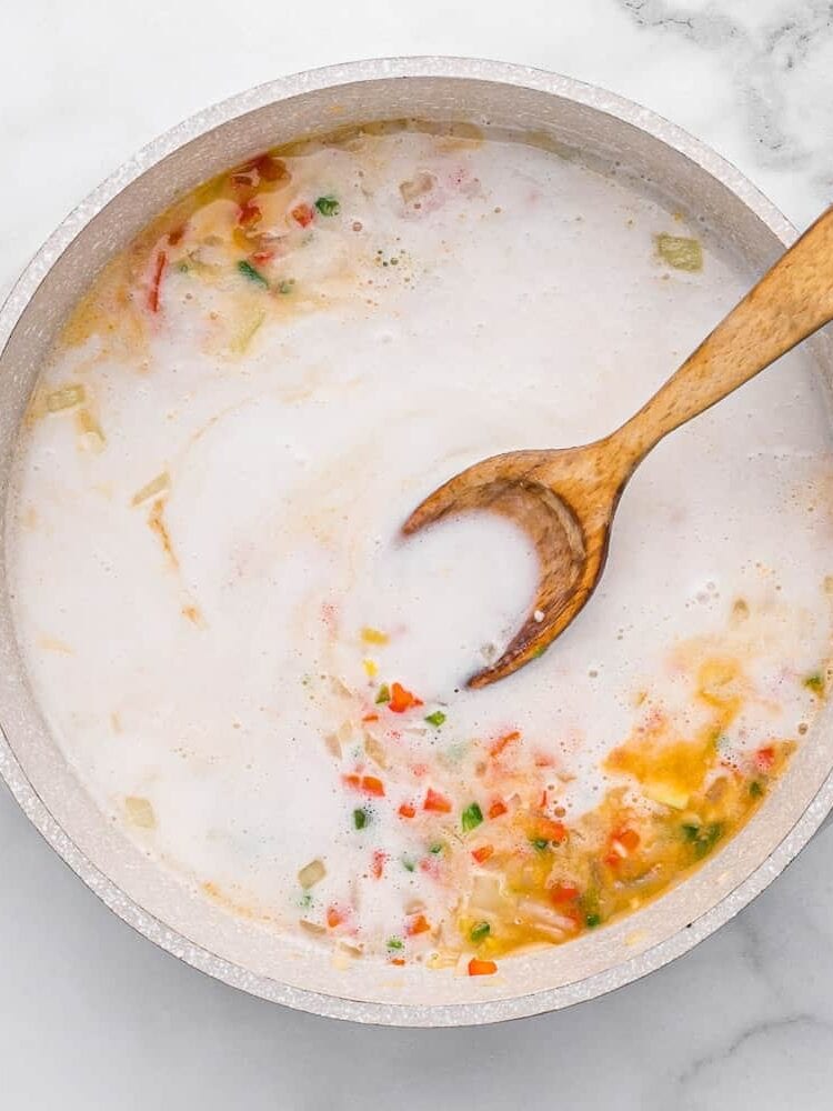 Coconut milk added to pan.