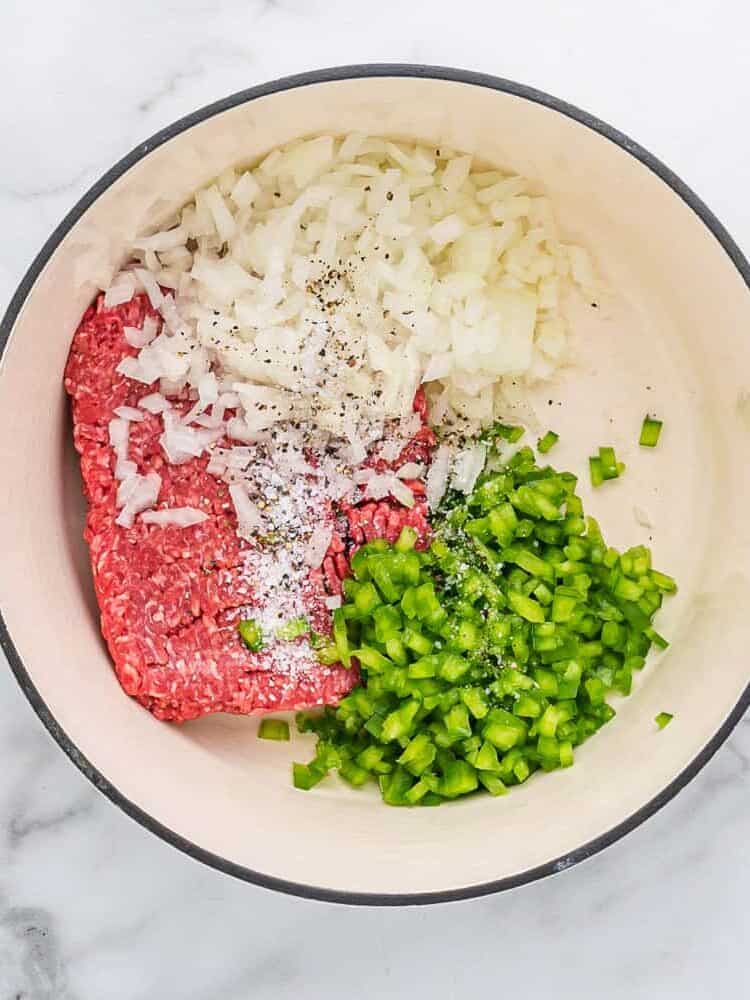 Uncooked beef, onions, green peppers.