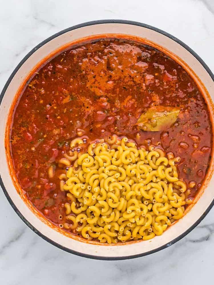 Macaroni pasta added to pot.