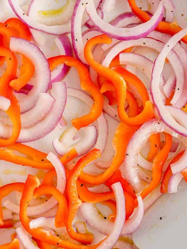 Onions and peppers being sautéed.